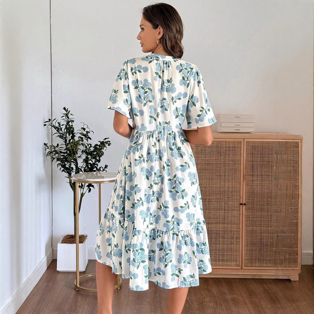 Dame midikjole med friske blomsterprint og voluminøs nederdel Skovae