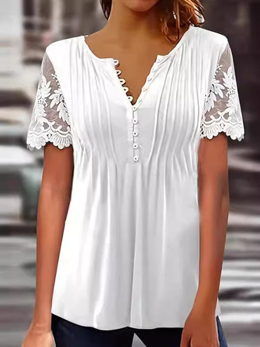 Damebluse med spidse detaljer og plissering Stilla