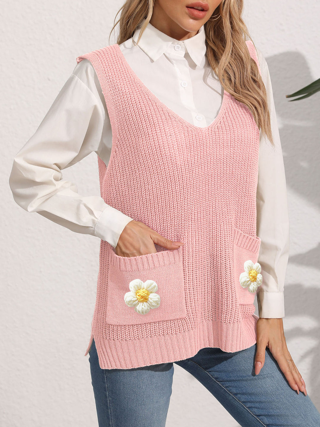 Dame strikvest med lommer og florale applikationer Stilla