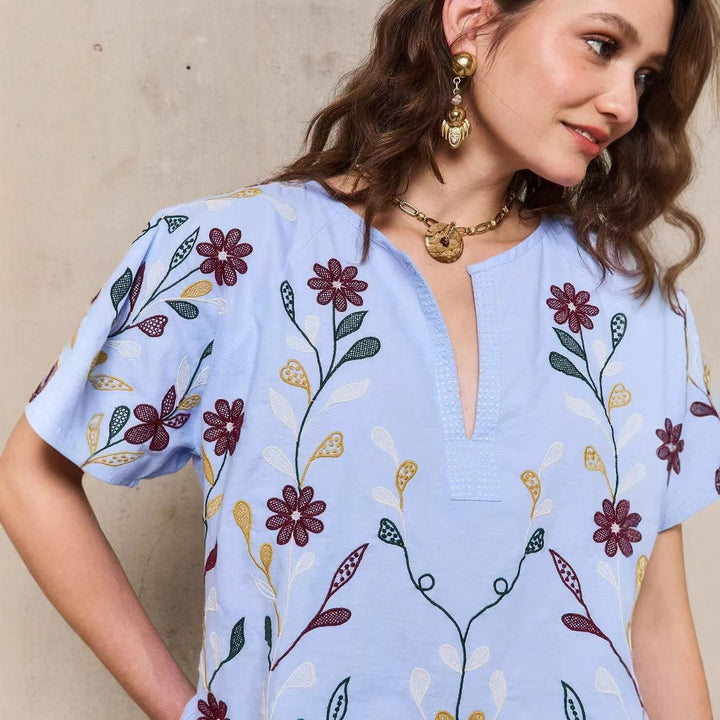 Dame tunika med kunstnerisk blomsterbroderi design Stilla