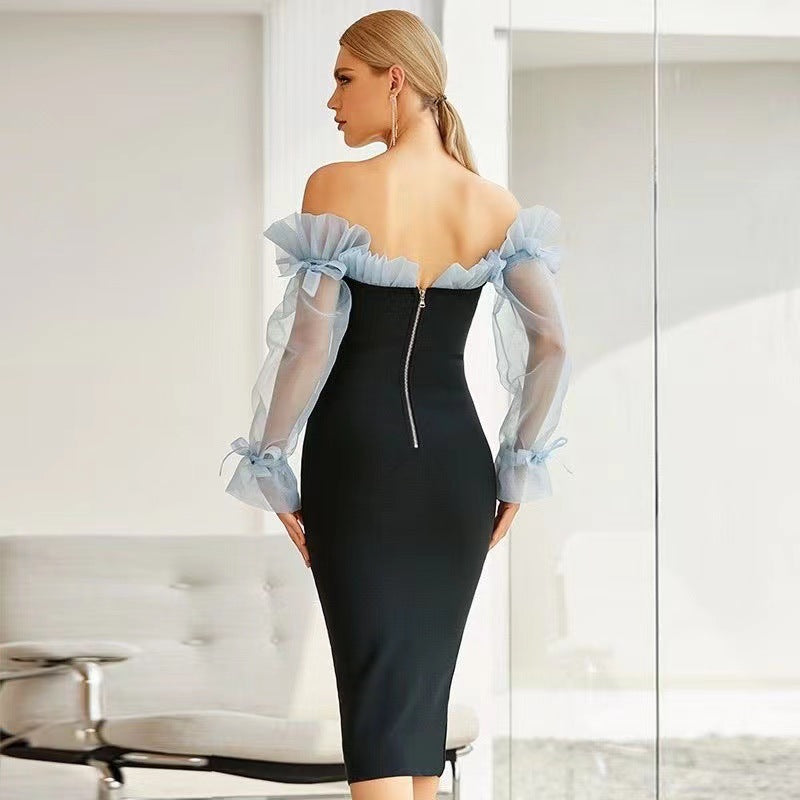 Kvinders figursyet cocktailkjole med transparente puffærmer og elegant v-hals
