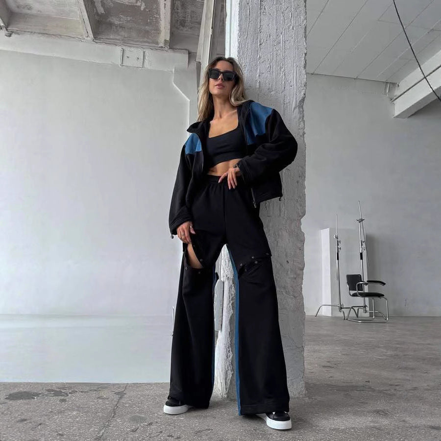 Kvinders fashionable casual outfit med sporty jakke og kreativt udskårne bukser Skovae
