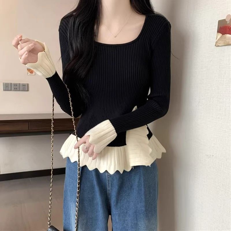 Kvinders fashionable ribstrikkede sweater med asymmetrisk kant Stilla