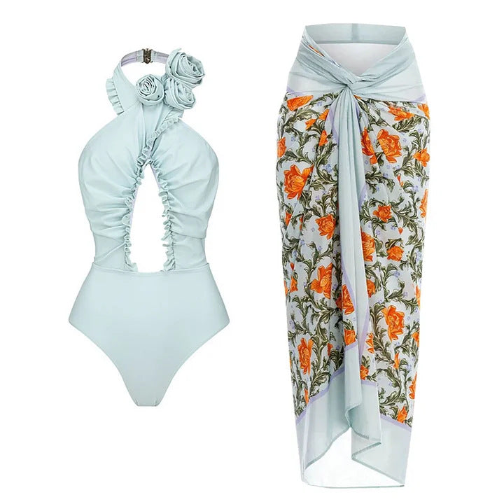 Dame svømmedragt med blomstret design og raffineret cut-out-look Skovae