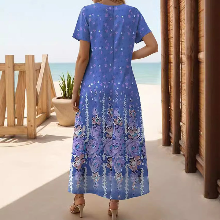 Dame maxikjole med floralt design og sidelæg Stilla