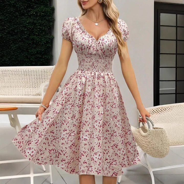 Dame Floral Midi-Kjole med elastisk Talje og Puffærmer Stilla