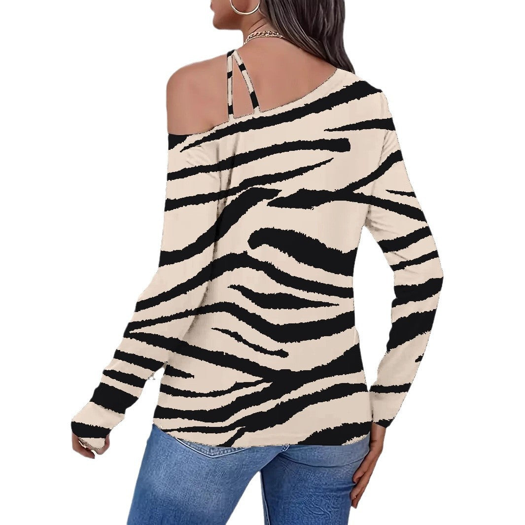 Dame casual top med ekstravagant skulderdesign og dyreprint Stilla