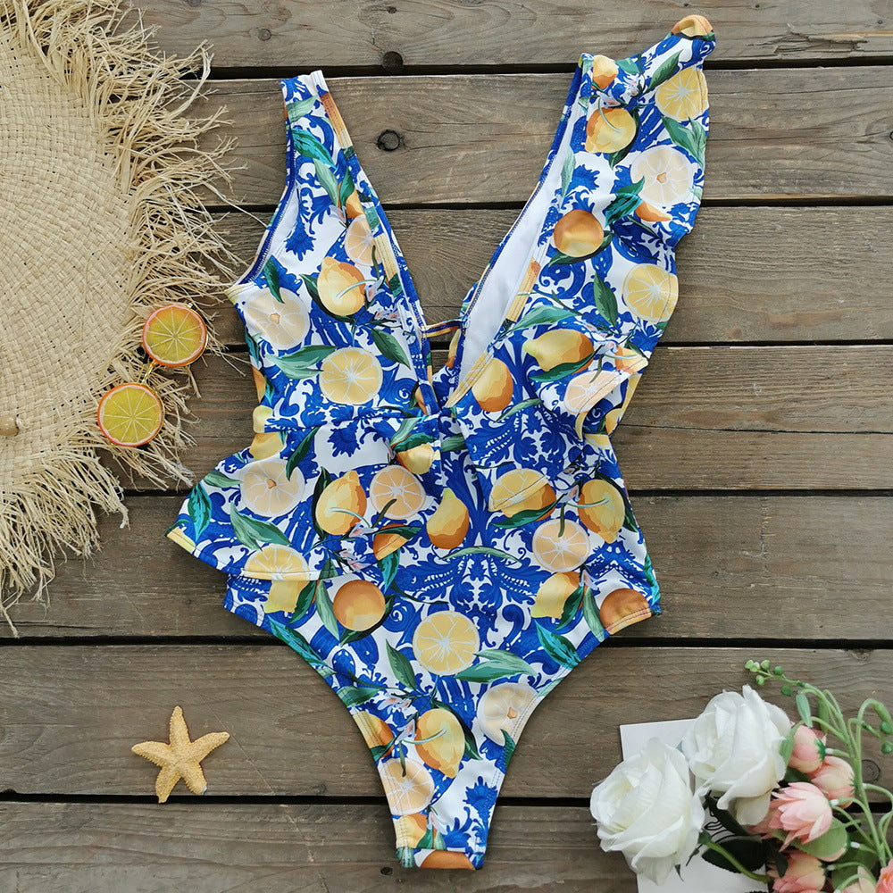 Dame strandnederdel med farverigt frugtdesign og elegant sløjfebånd Stilla