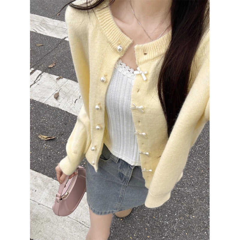 Kvinders hyggelige cardigan med perleknapper og delikat design Stilla