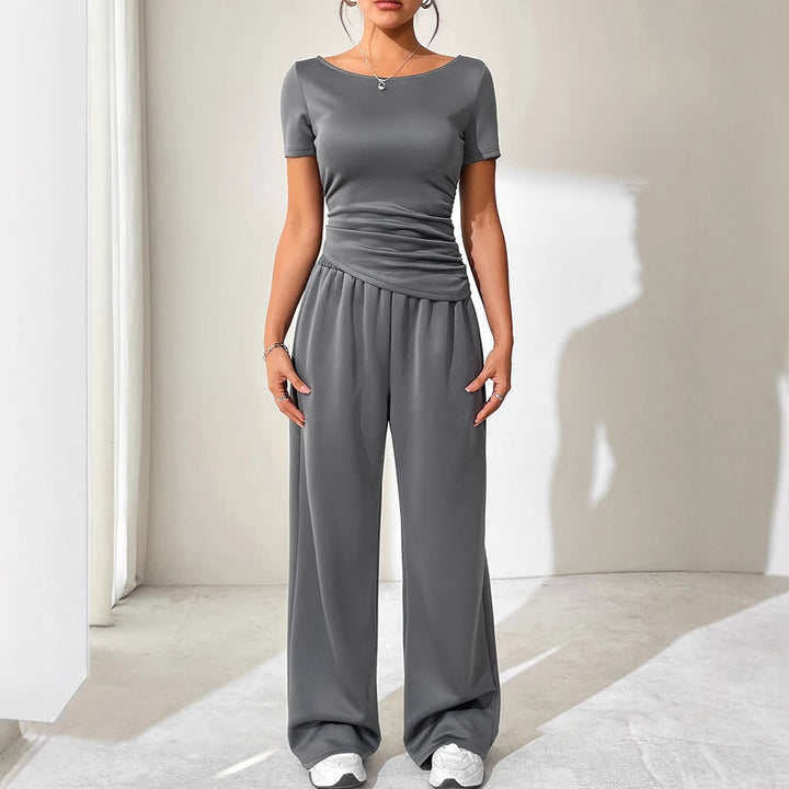 Dame jumpsuit med asymmetrisk snit og bredt skåret ben Skovae