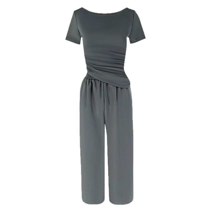Dame jumpsuit med asymmetrisk snit og bredt skåret ben Skovae