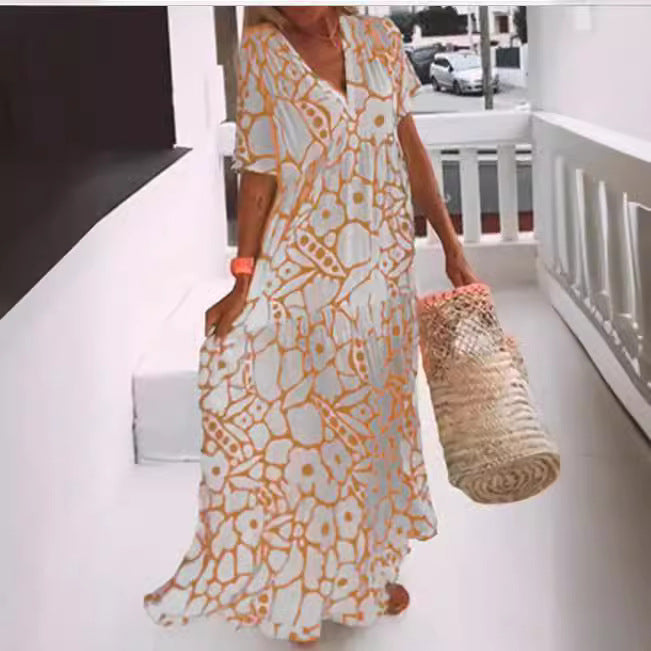 Dame Maxikjole med blomsterdesign og elegant V-udskæring Stilla