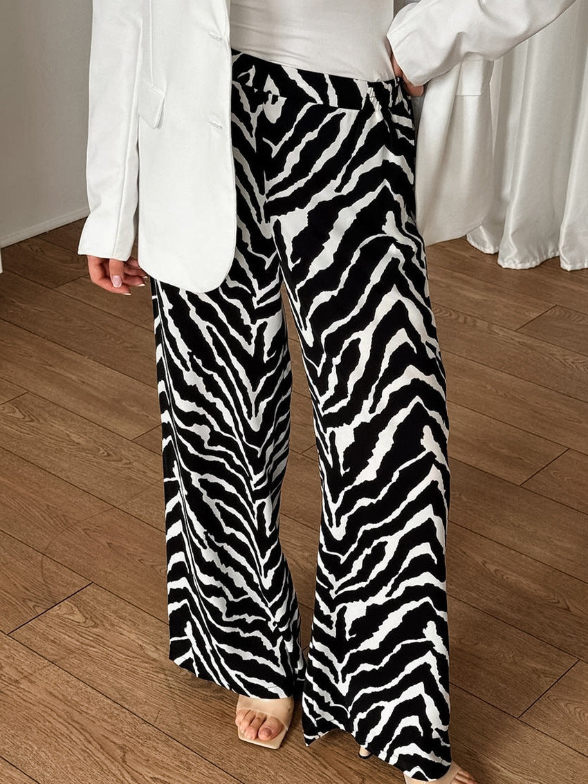 Dame bred Zebra-print Palazzo-bukser med elastisk talje og elegant snit Stilla