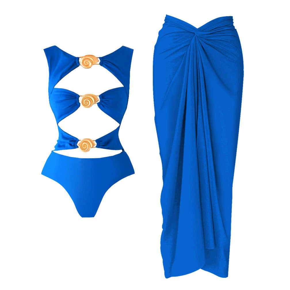 Dame én-delt badedragt med grafisk cut-out-design og glitrende musling-accenter Stilla