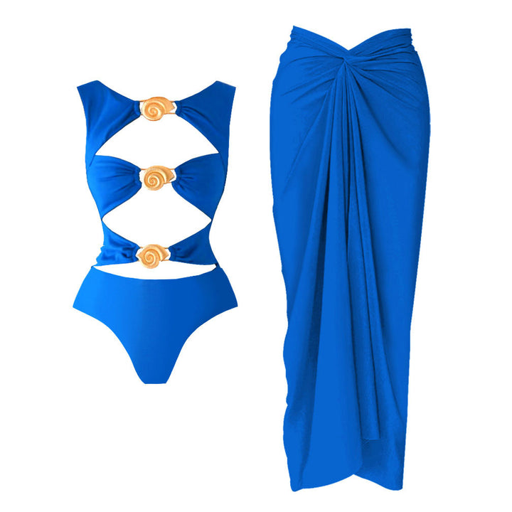 Dame én-delt badedragt med grafisk cut-out-design og glitrende musling-accenter Stilla