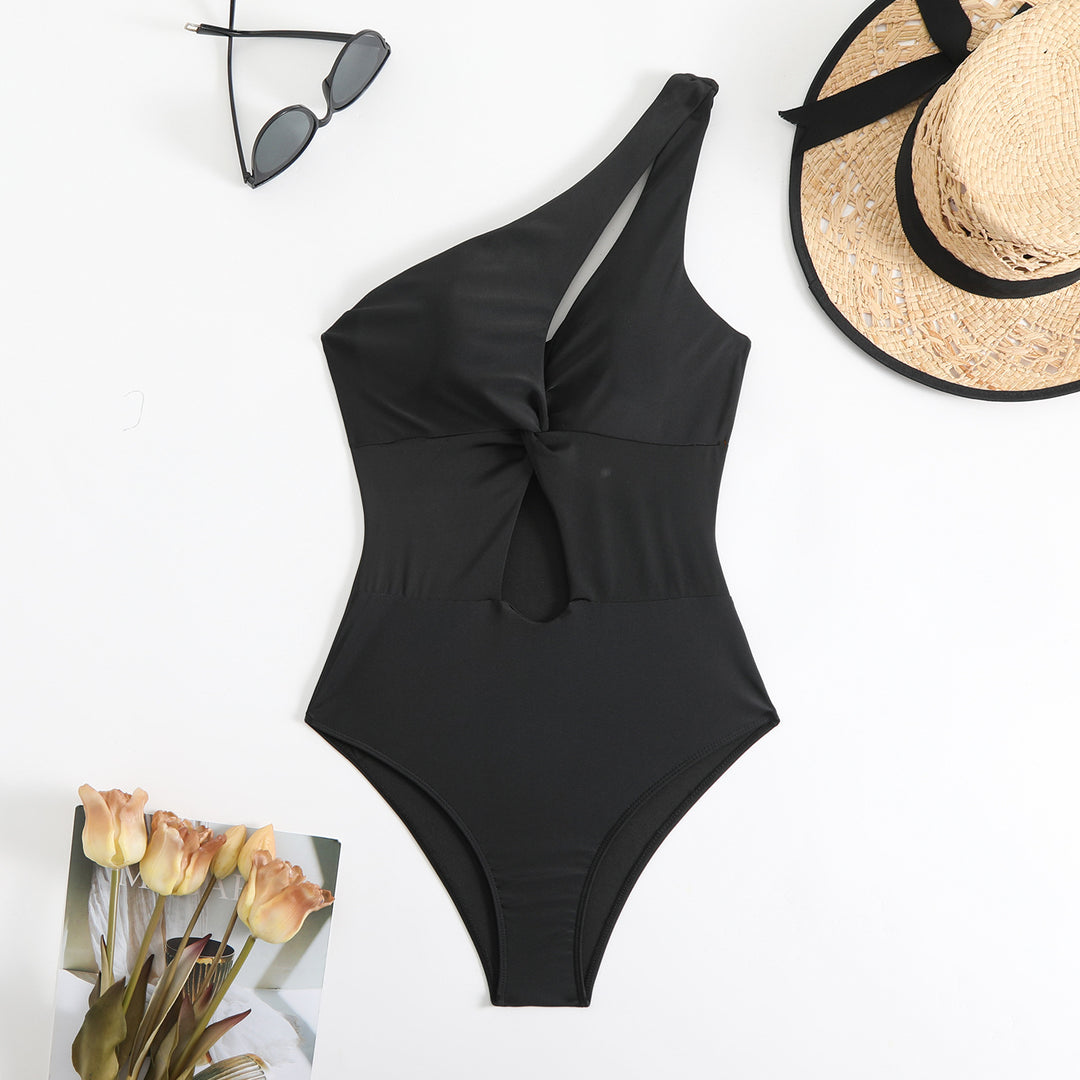 Dame one-piece badedragt med asymmetrisk snit og knudeformet detalje Stilla