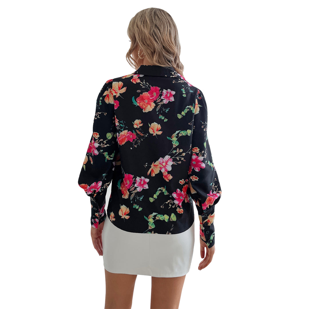 Kvindernes elegante bluse med blomster mønstre og pufærmer Stilla