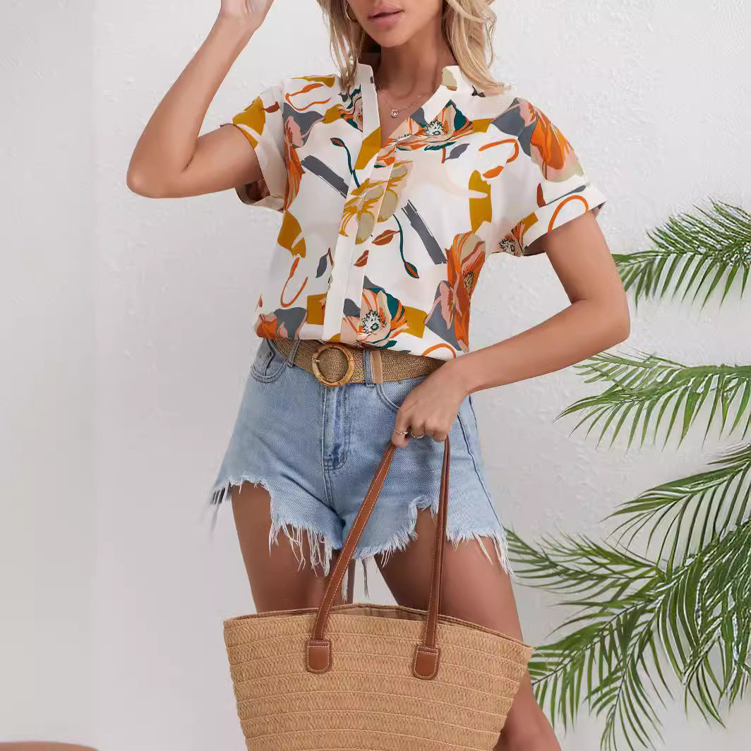 Dame kortærmet bluse med blomstret design Stilla