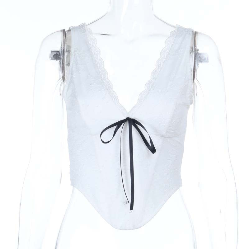 Dame spids-bustier med elegant V-udskæring og dekorativ sløjfedetalje Skovae
