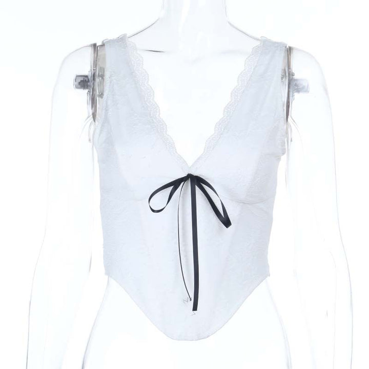 Dame spids-bustier med elegant V-udskæring og dekorativ sløjfedetalje Skovae