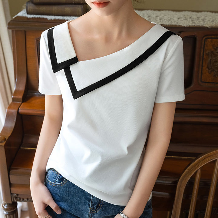 Dame elegant top med en moderne asymmetrisk krave og stilfulde kontrastaccenter Stilla