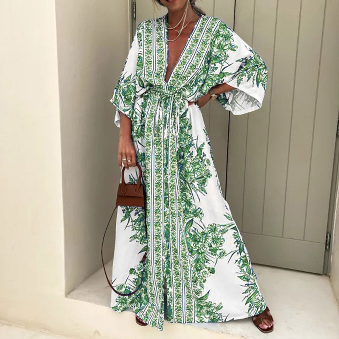 Dame let kaftan med kunstnerisk blomsterdesign og elegante detaljer Stilla
