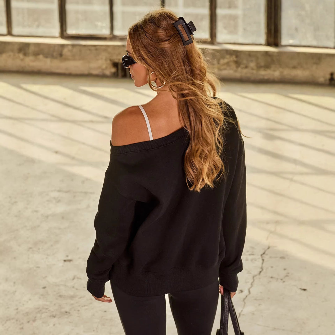 Kvinders afslappede off-shoulder sweater med brede ærmer og fashionable accenter Skovae