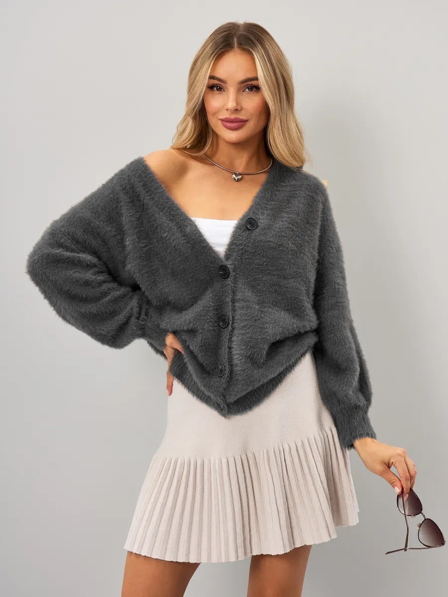 Kvinders hyggelige cardigan med asymmetrisk snit og knaplukning Stilla