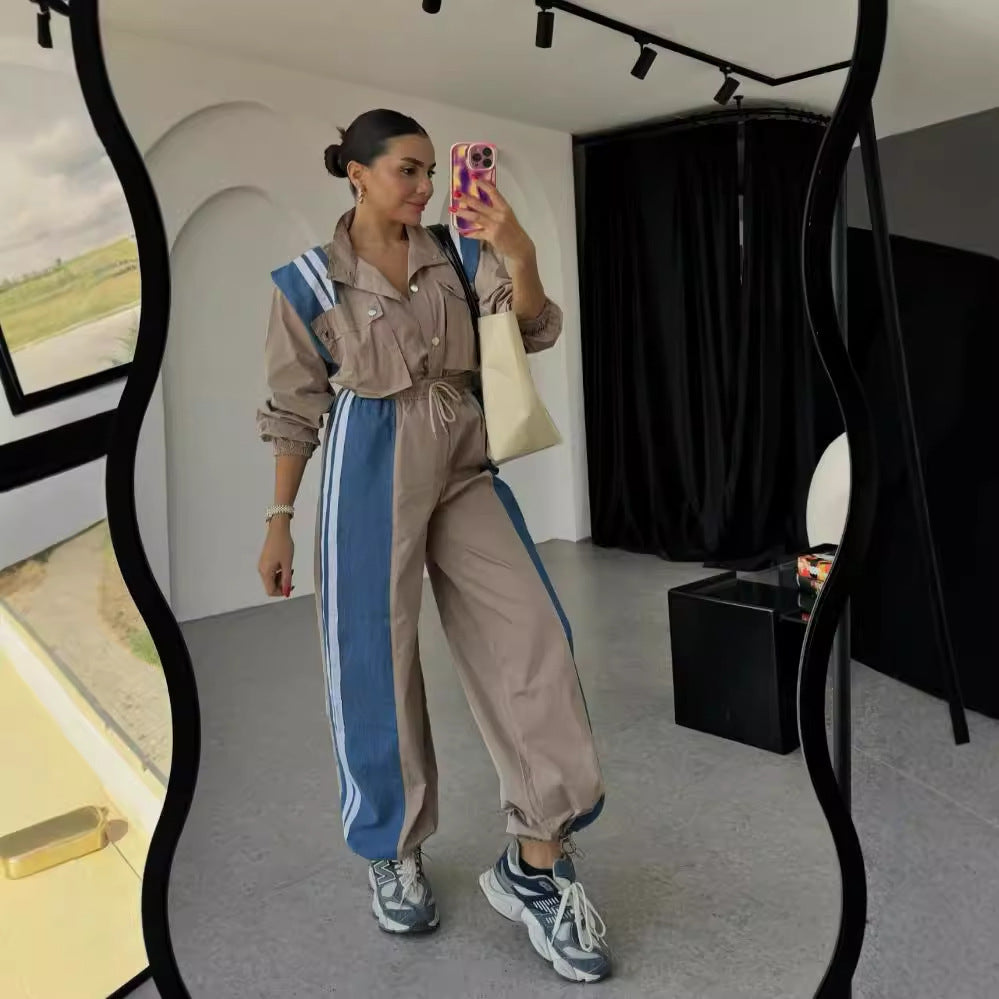 Dame sporty jumpsuit med sofistikeret snoreliv og kontraststriber Stilla