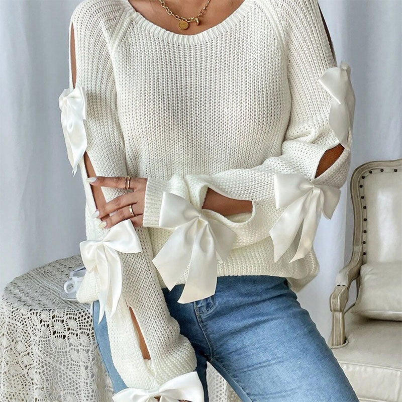 Kvinders strikket sweater med dekorative bue detaljer og åbent ærme design Stilla