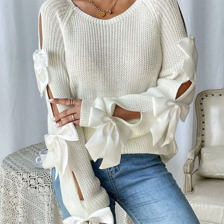 Kvinders strikket sweater med dekorative bue detaljer og åbent ærme design Stilla
