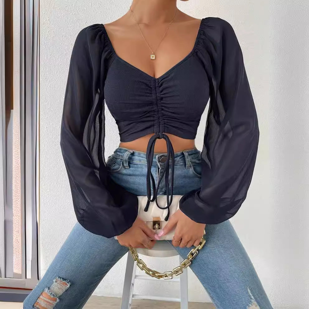 Dame Crop-Top med struktureret krop og elegante pufærmer Skovae