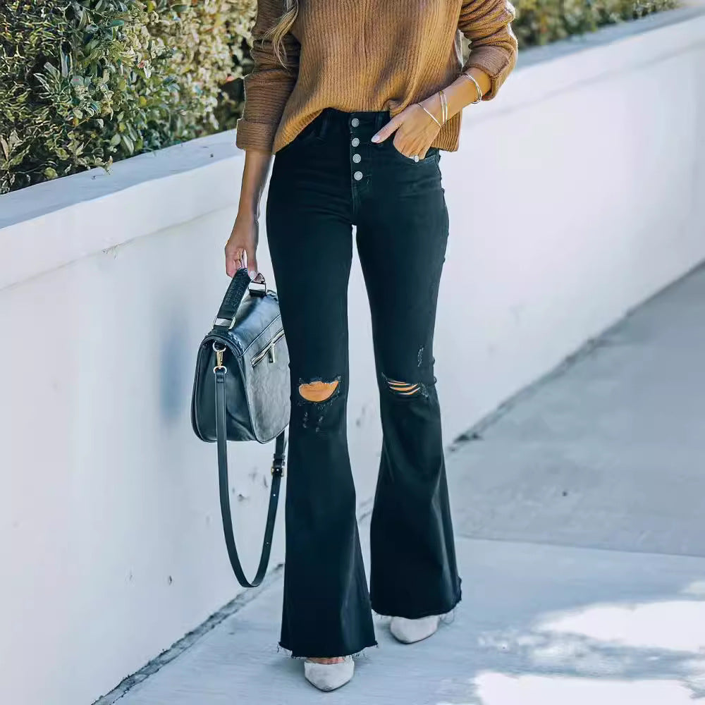 Dame flared jeans med destroyed detaljer og høj talje stil