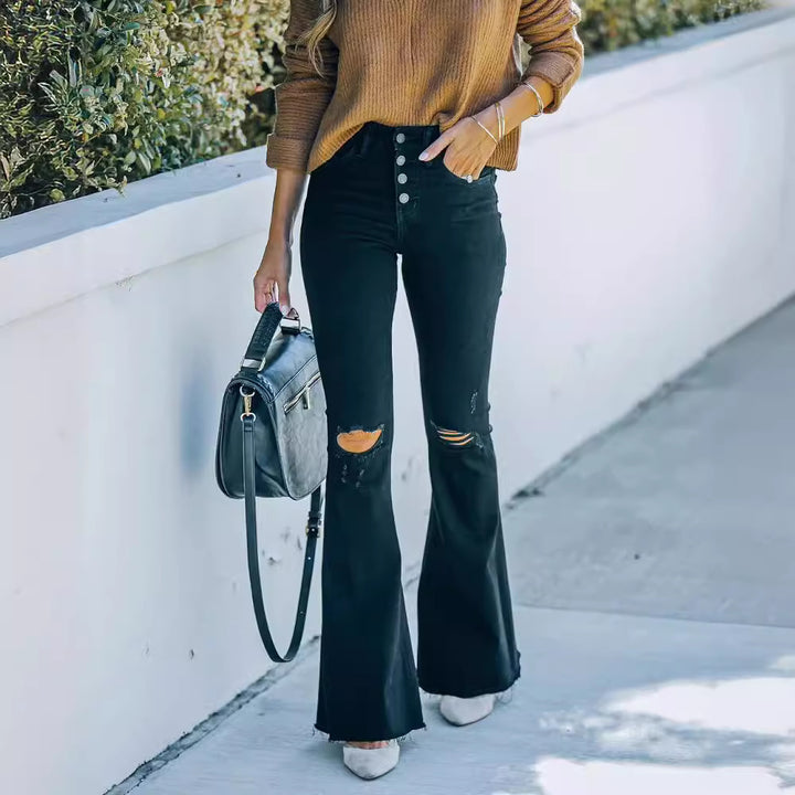 Dame flared jeans med destroyed detaljer og høj talje stil