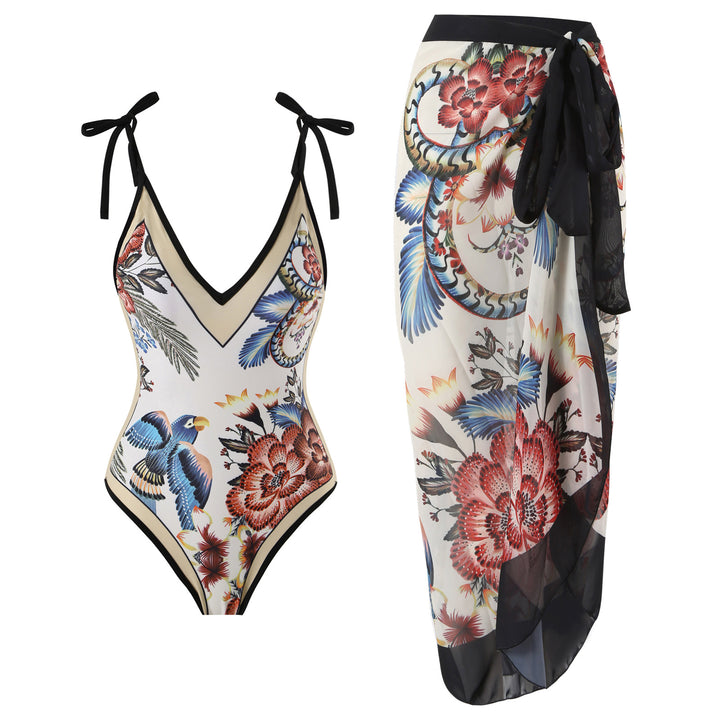 Dame heldragt badedragt med floralsk design og elegant omslagsskørt Stilla