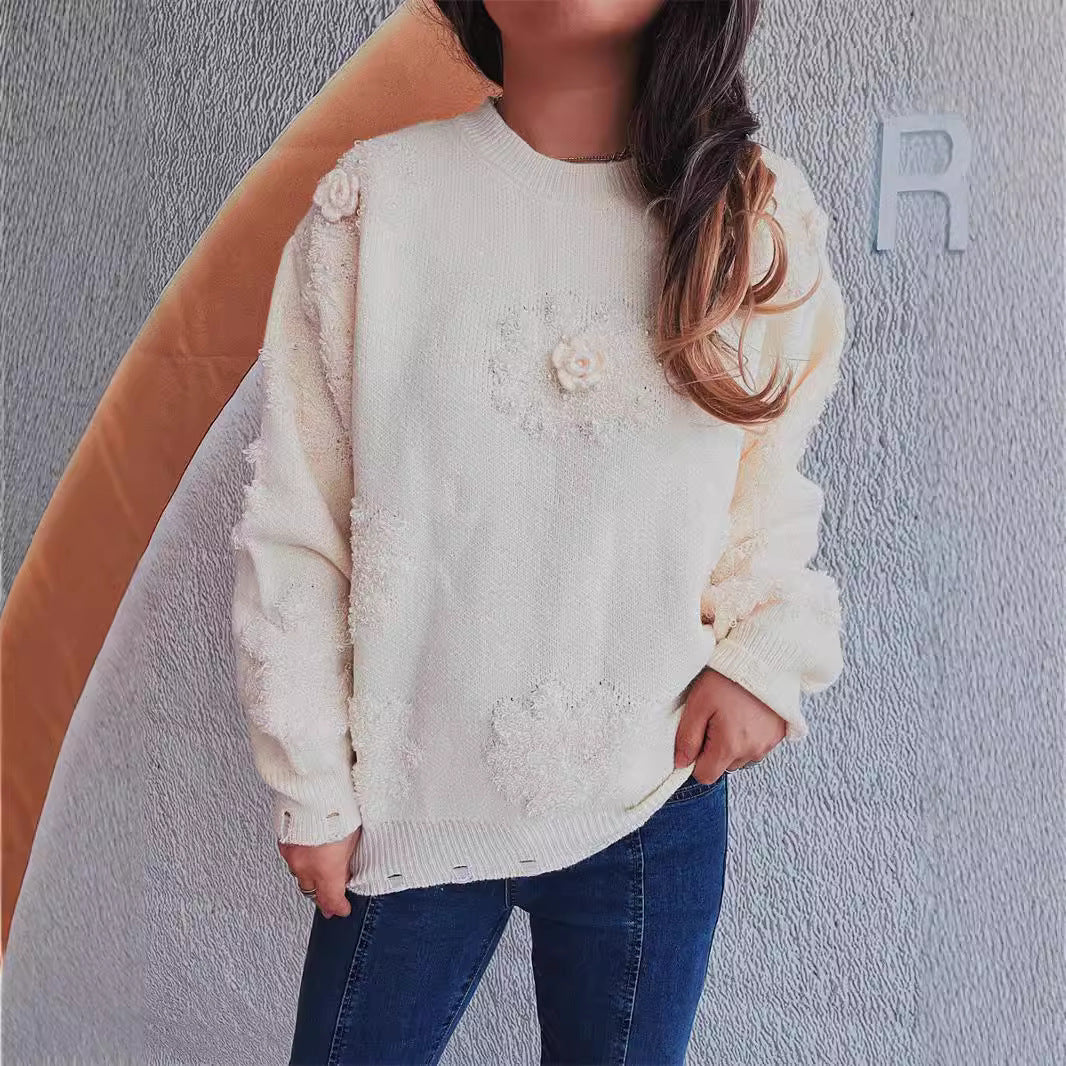 Kvindernes glade sweater med blomsterapplikationer og tekstureret strikdesign Stilla