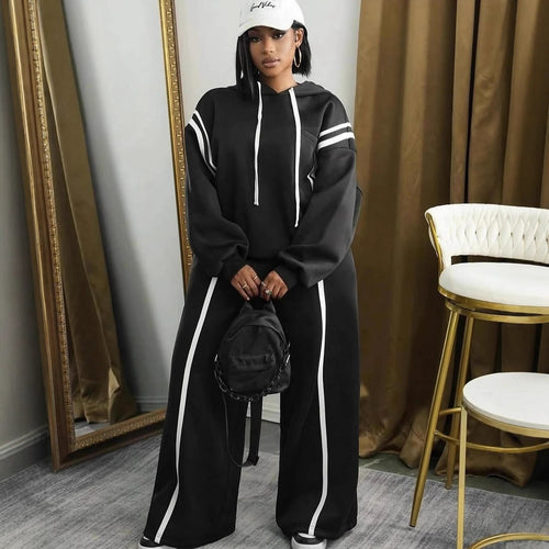 Kvinders sporty hoodie og bukser med brede ben med elegante striber