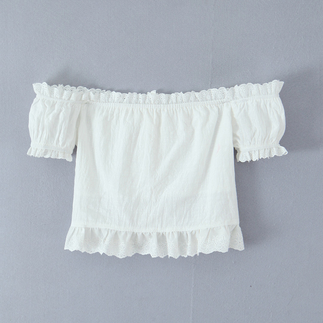 Damer rynket bluse med off-shoulder design og dekorative knapdetaljer Stilla
