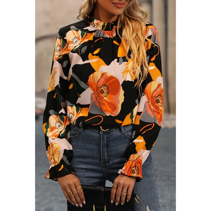 Damebluse med blomsterprint og flæseudskæring i lange ærmer Stilla