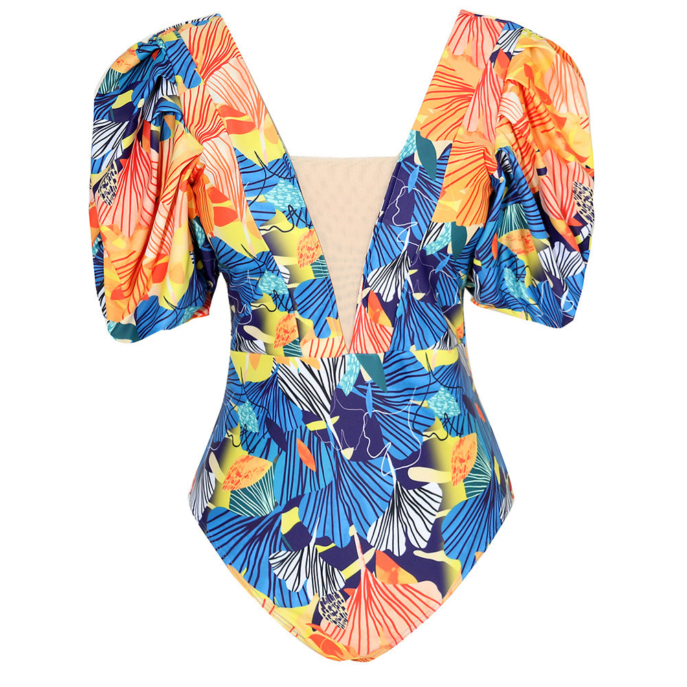 Damer heldragt badedragt med ekstravagante volumenærmer og farverigt plante mønster Stilla
