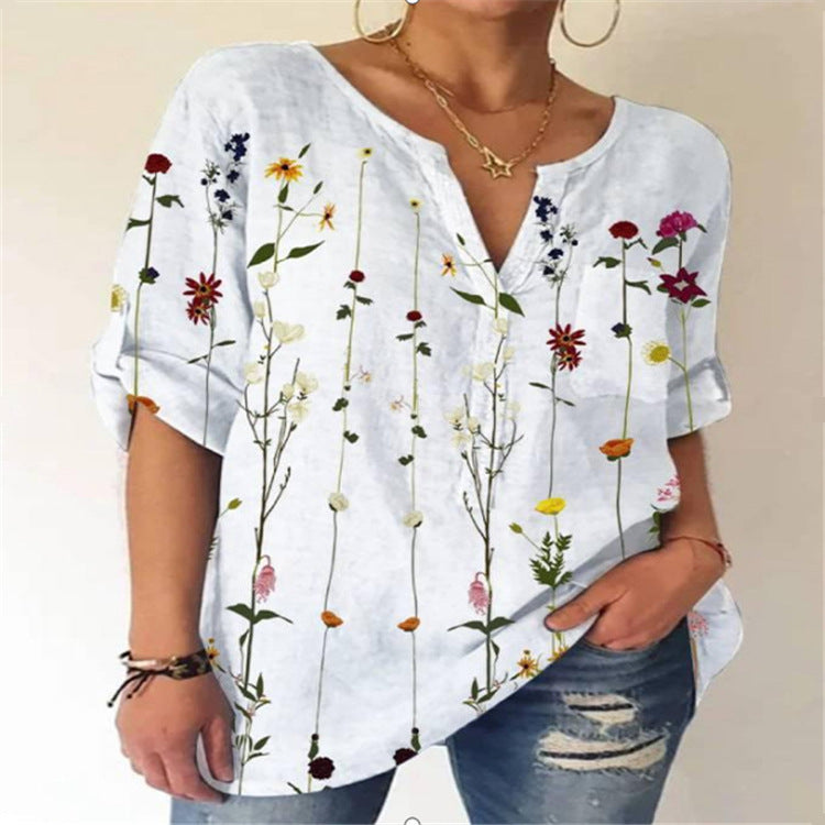 Damebluse med floral broderedesign og V-hals Stilla