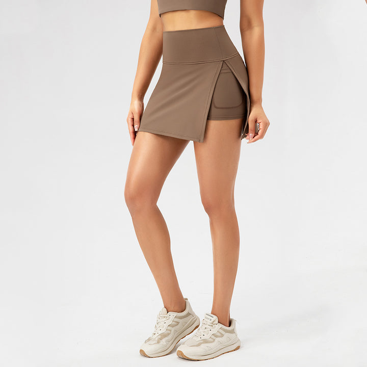 Dame sportskørt med integreret shorts og elegant asymmetrisk snit Stilla