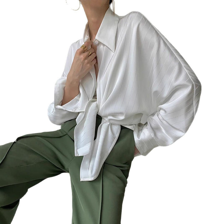 Dame asymmetrisk bluse med elegant taljeudtræk Stilla