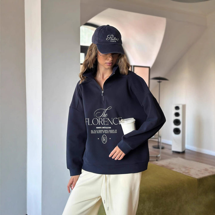 Kvinders statement sweater med høj krave og praktisk lynlås Stilla