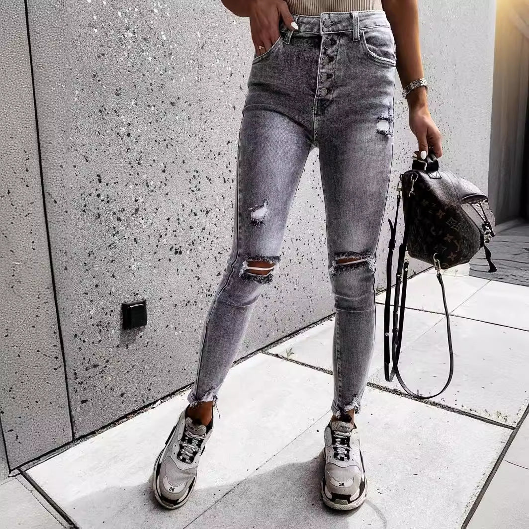 Dames skinny jeans med høje lommer og trendy slidte detaljer