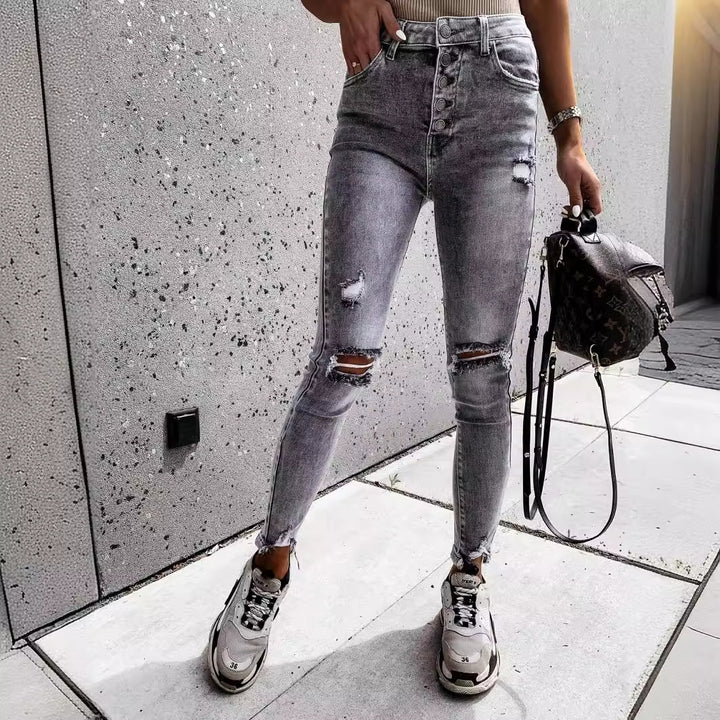 Dames skinny jeans med høje lommer og trendy slidte detaljer