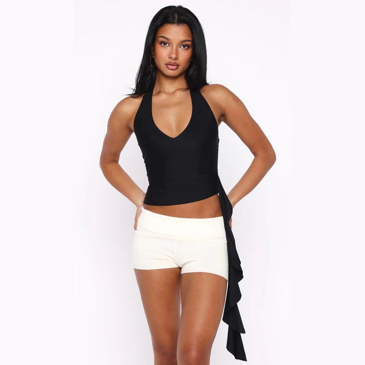 Dame Elegant top med dyb V-hals og asymmetrisk design Skovae