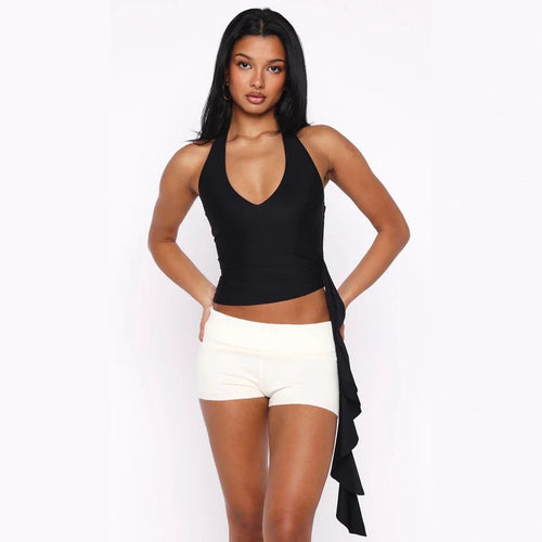 Dame Elegant top med dyb V-hals og asymmetrisk design Skovae