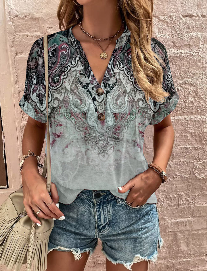 Damebluse med blomsterdesign og knaplukning Stilla