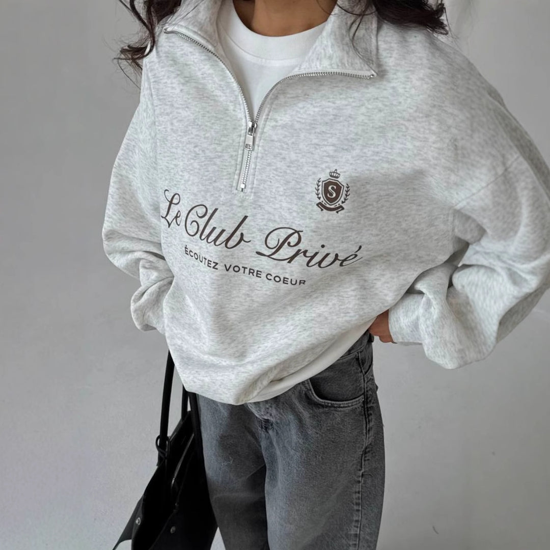 Kvinders afslappede pullover med halv lynlås og grafisk print Stilla